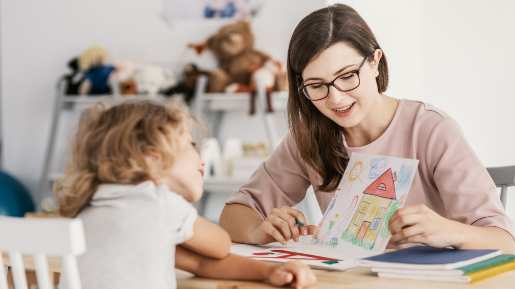 Therapist examining a child's drawing - Autism Spectrum Disorder Support and Therapy is available at The Therapy Centre in Toronto, Oakville and Hamilton