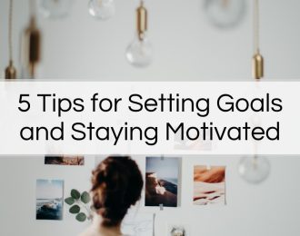 Woman looking at images pinned to wall - 5 Tips for Setting Goals and Staying Motivated - Article by The Therapy Centre